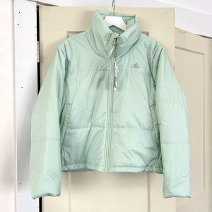 Adidas women’s puffer jacket in Linen green. Size M NWT